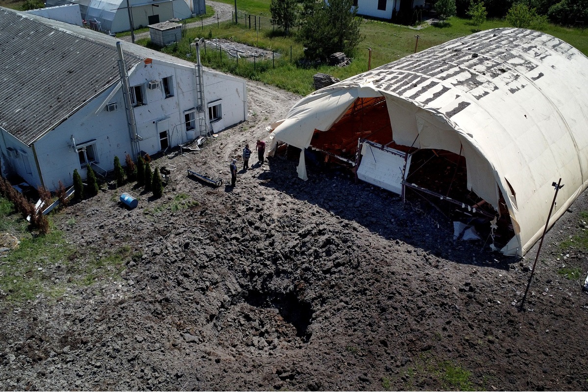 A crater is seen in front of a hangar at a damaged private airfield following a military strike, amid Russia's attack on Ukraine, on the outskirts of Kharkiv, Ukraine June 4, 2022. Picture taken with drone. (Photo by Reuters)