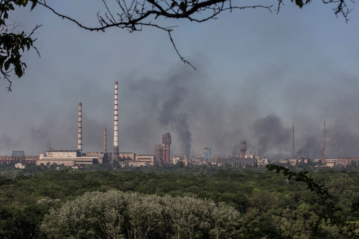 Smoke rises after a military strike on a compound of Sievierodonetsk's Azot Chemical Plant, amid Russia's attack on Ukraine, in the town of Lysychansk, Luhansk region, Ukraine June 10, 2022. (Photo by Reuters)