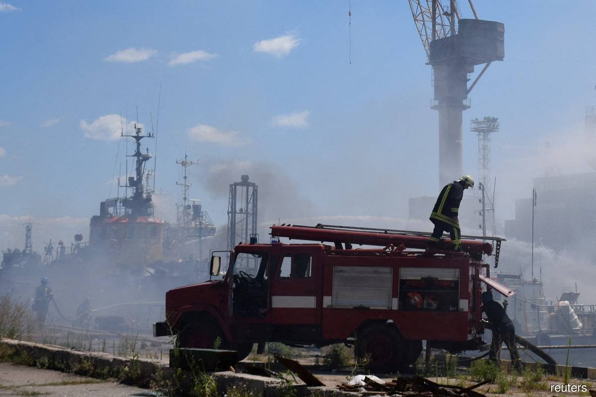 Firefighters working at a site of a Russian missile strike in Odesa, Ukraine on July 23, 2022.
