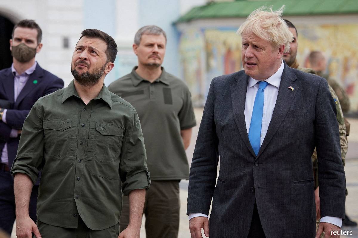 British Prime Minister Boris Johnson (right) and Ukraine's President Volodymyr Zelenskiy (left) visiting an exhibition of destroyed Russian military vehicles and weapons at Mykhailivska Square in Kyiv, Ukraine on June 17, 2022.