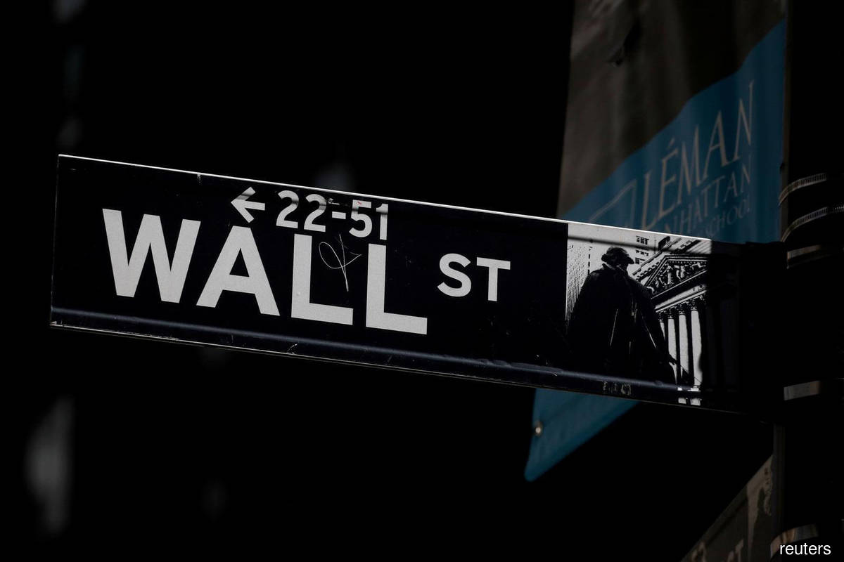 Wall Street closes at record but Facebook weighs