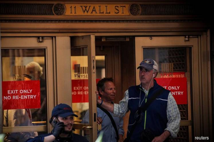 Wall Street tumbles at open on fear over fresh coronavirus cases