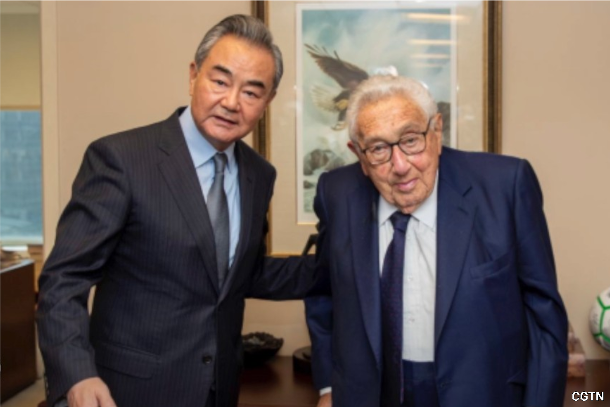 Wang Yi (left) and Henry Kissinger