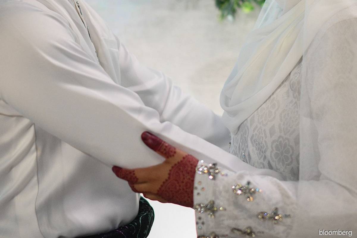 Malaysian marriages rise after pandemic in 2021 as divorces drop